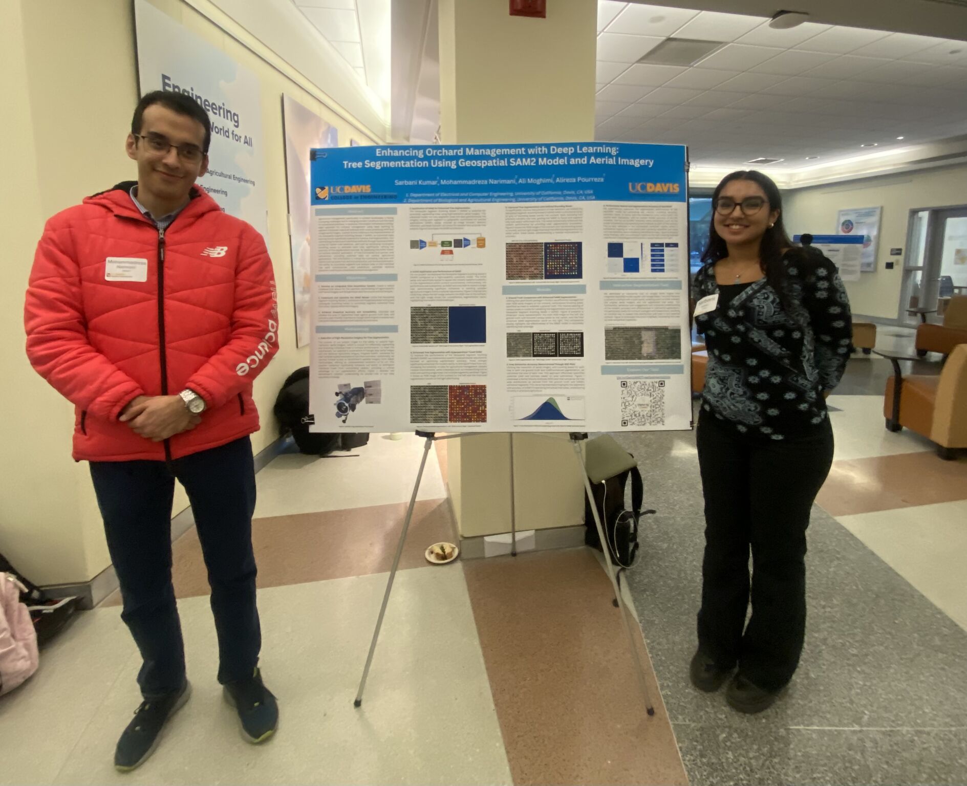 Mohammadreza Narimani PhD candidate mentoring undergraduate student Sarbani Kumar presenting orchard management deep learning research poster using Geospatial SAM2 at UC Davis ESEARCH Fall 2024