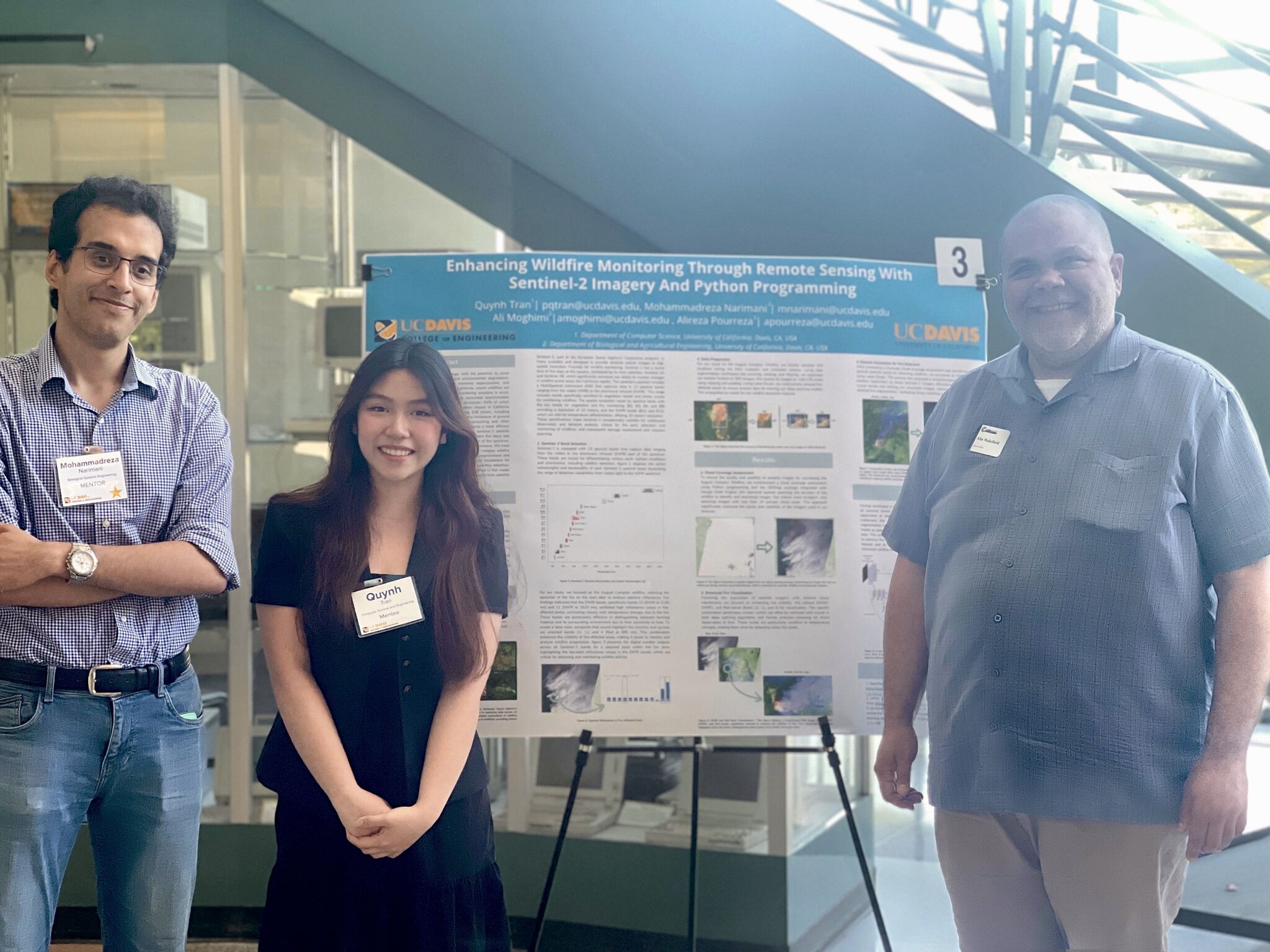 Mohammadreza Narimani PhD candidate mentoring undergraduate student Quynh Tran presenting wildfire monitoring research poster at UC Davis ESEARCH Spring 2024 program