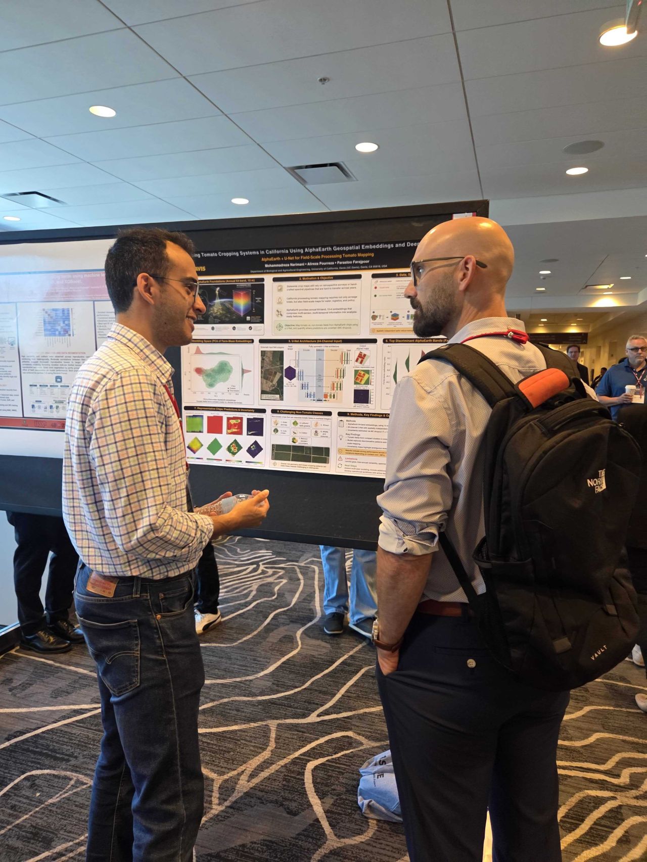 Mohammadreza Narimani explaining AlphaEarth geospatial embeddings and tomato crop mapping to an attendee at ASABE 2026